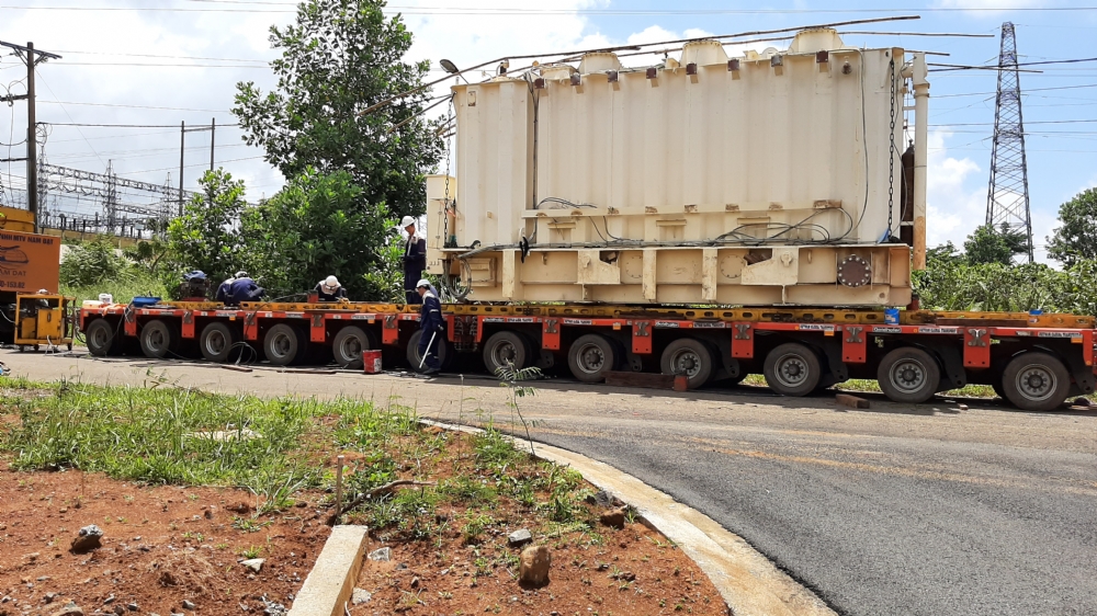 Transport main transformer from Plieku to Bao Loc and placing onto foundation.