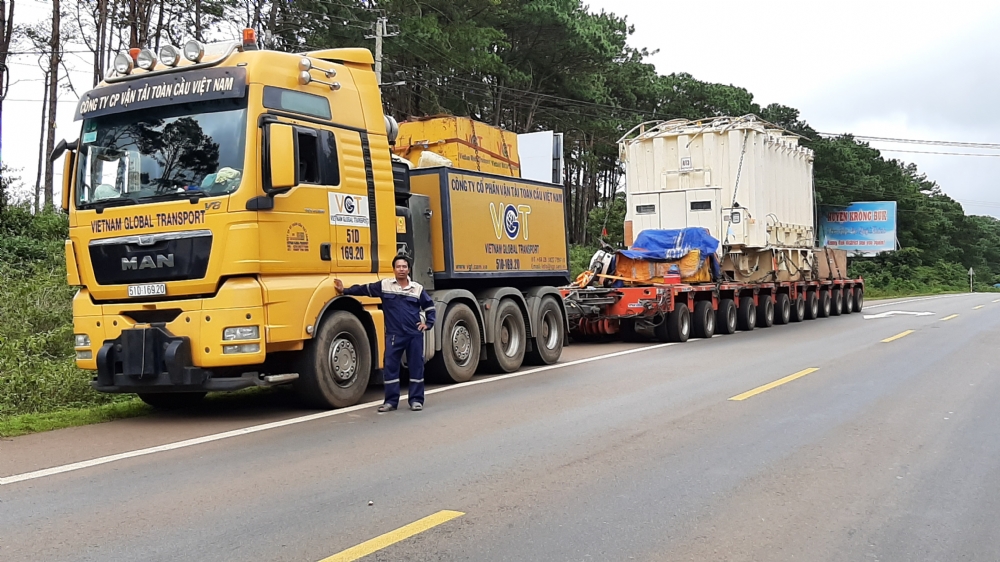 Transport main transformer from Plieku to Bao Loc and placing onto foundation.